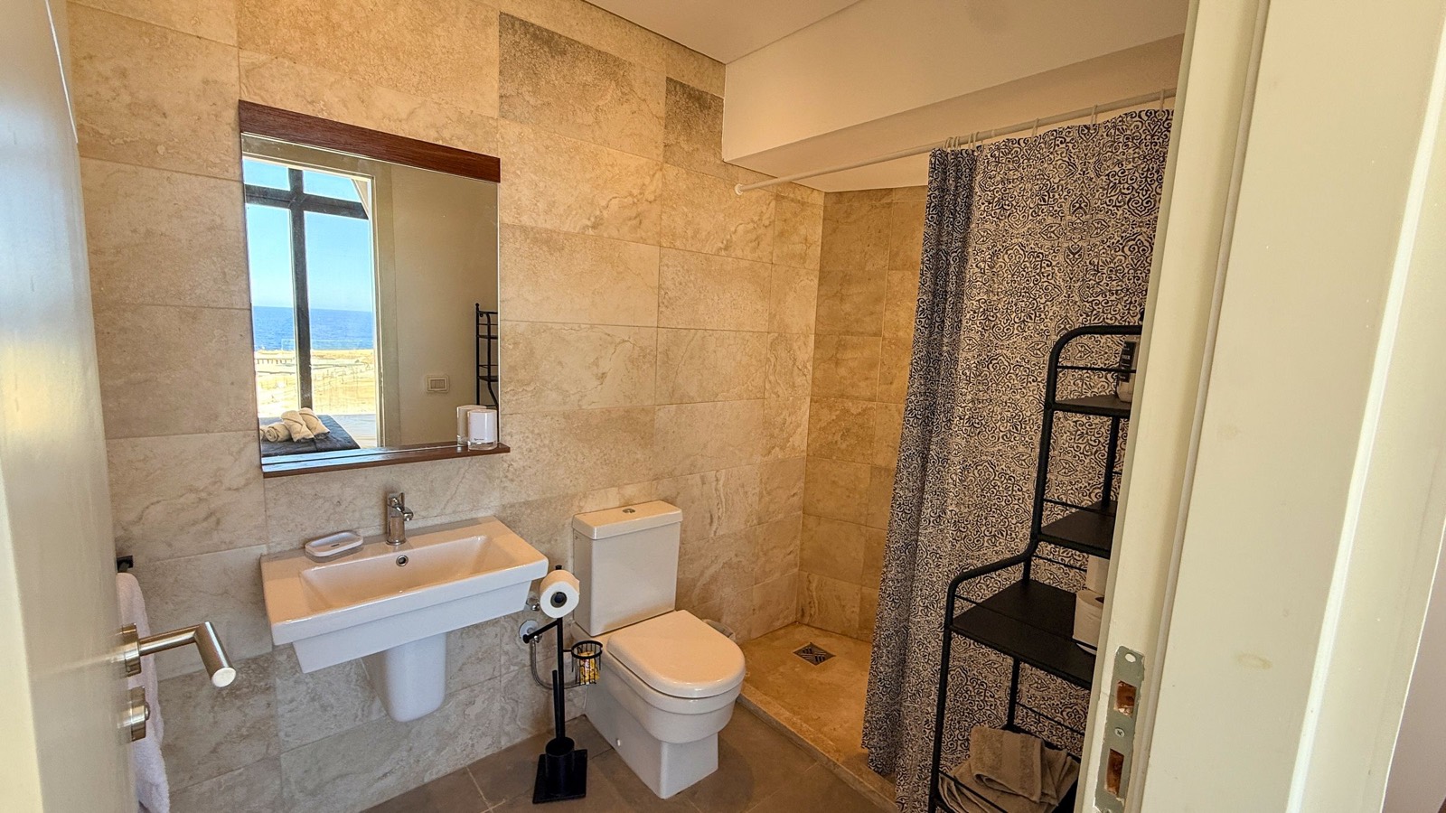 Shower room with a sea view