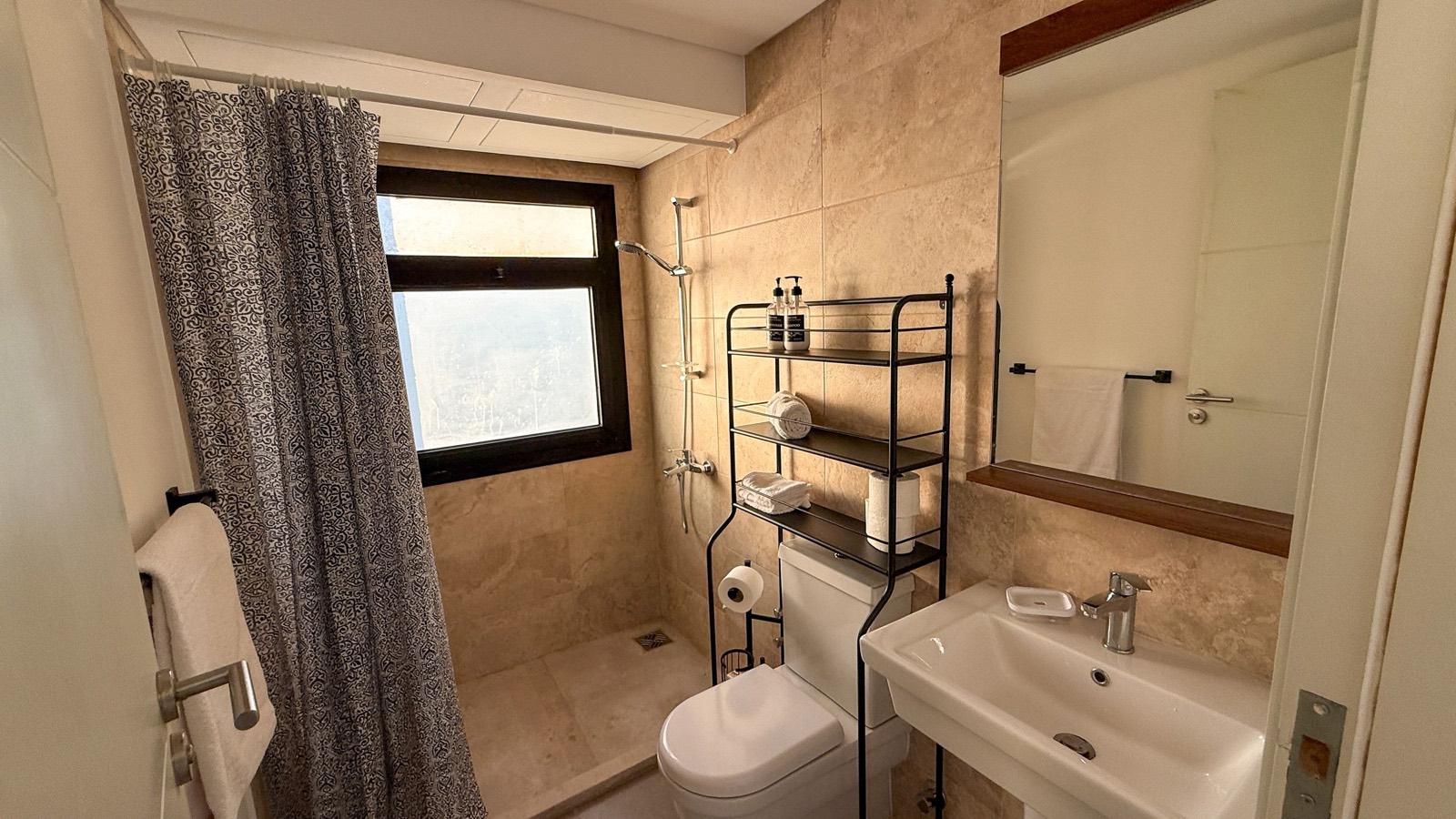 Shower room with towels and shelves