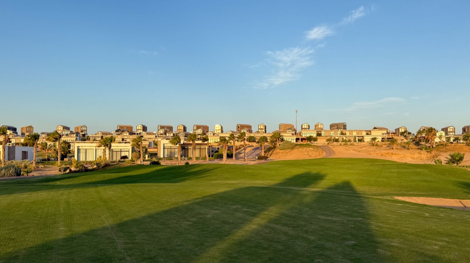 Golf fairway with homes behind