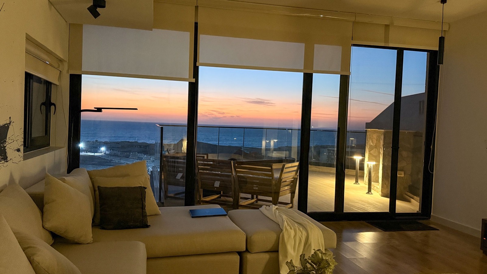 Sofa facing the sunset over the sea