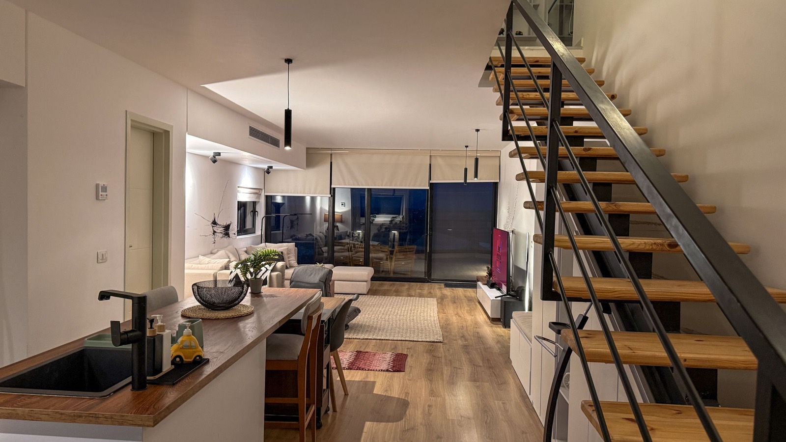 Open stairs and kitchen at night