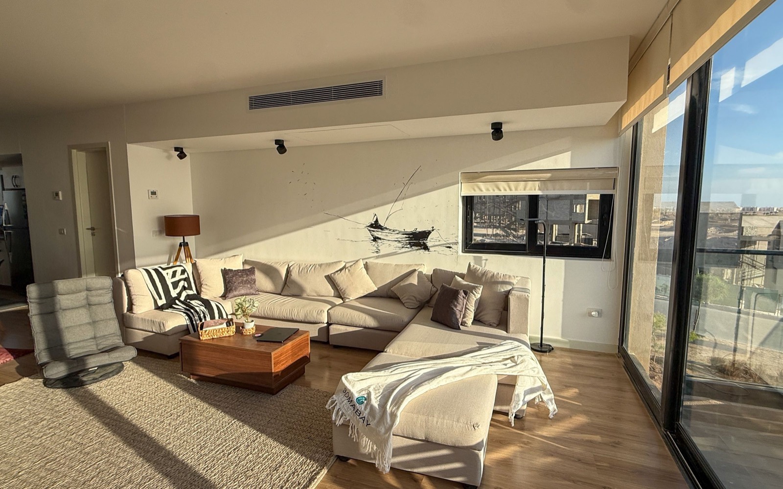Sunlit living room with the corner sofa