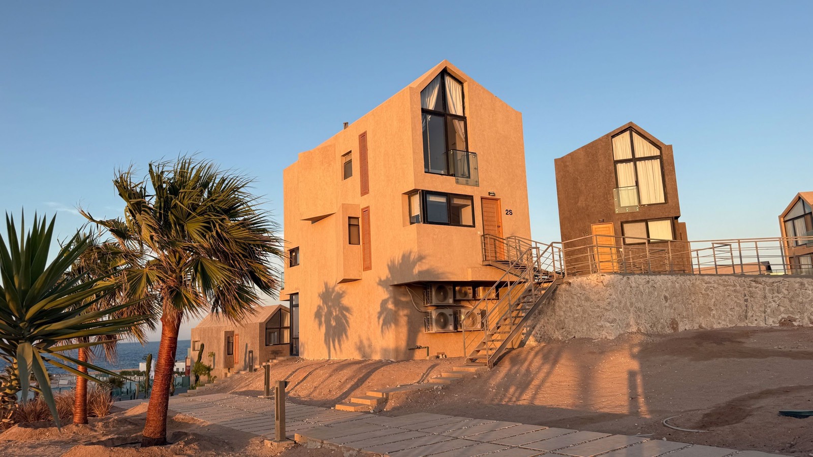 Two lodges in the golden evening light