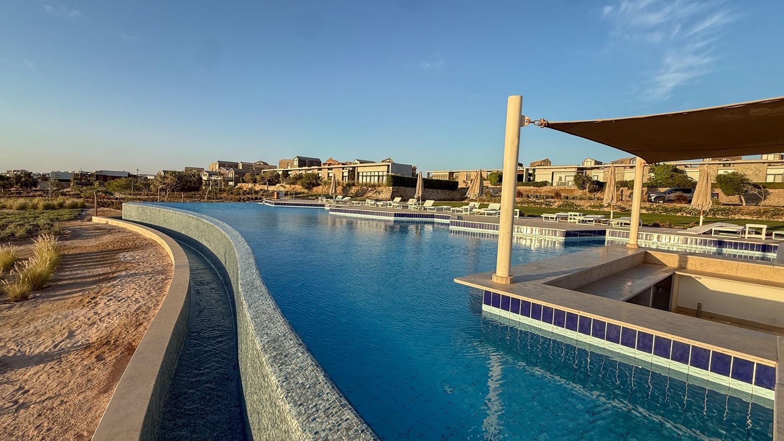 Community pool with shaded seating