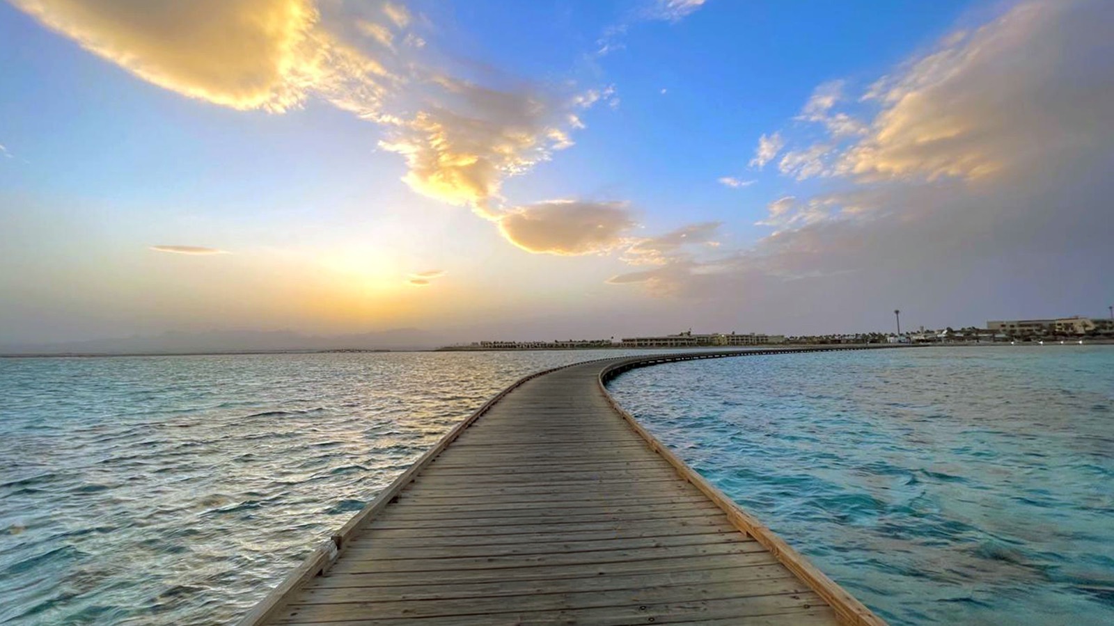 Wooden jetty over turquoise water